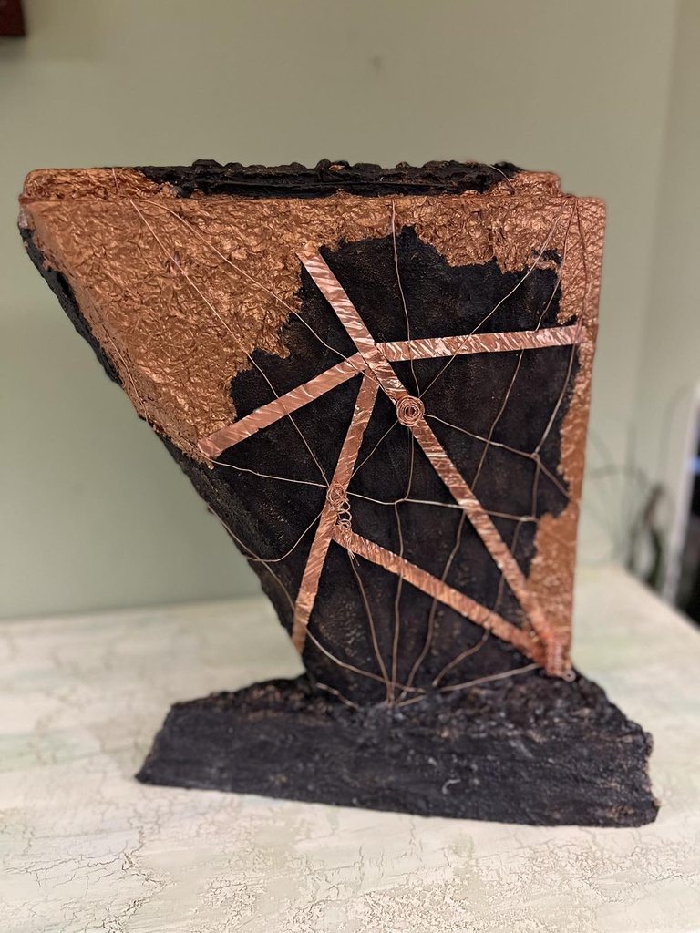 "Copper rock" sculpture with copper elements